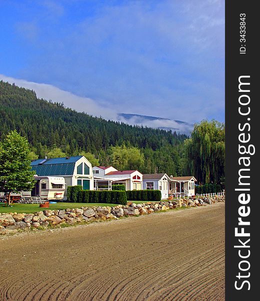 A view of the waterfront homes at Mara Lake, BC, Canada. This lake is located between Sicamous and Salmon Arm in the Okanagan - North Shuswap Region in British Columbia, Canada. A view of the waterfront homes at Mara Lake, BC, Canada. This lake is located between Sicamous and Salmon Arm in the Okanagan - North Shuswap Region in British Columbia, Canada.