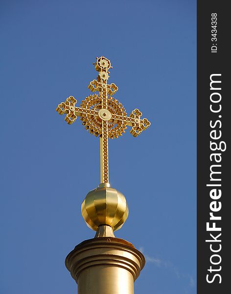 Gold cross on the top of cathedral