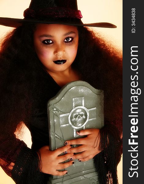 Beautiful 10 year old African American girl dressed as a witch for halloween. Beautiful 10 year old African American girl dressed as a witch for halloween.