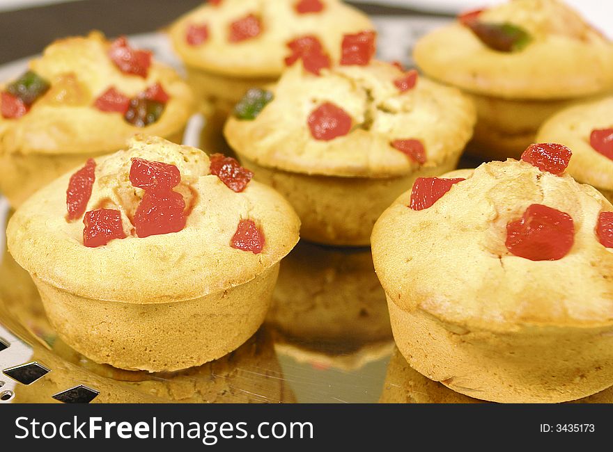 Upclose of cherry decorated muffins. Upclose of cherry decorated muffins