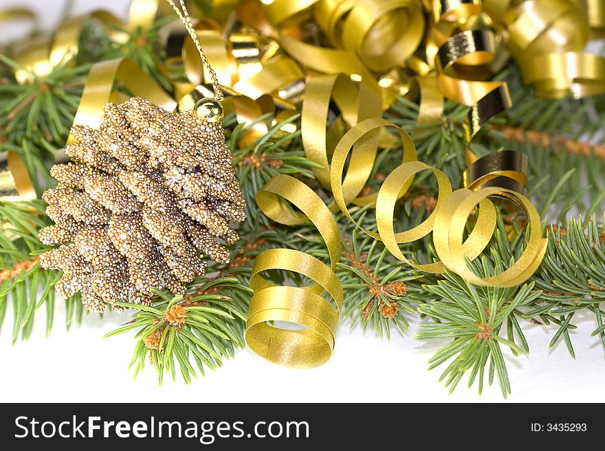 Decorative pine cone with gold ribbon