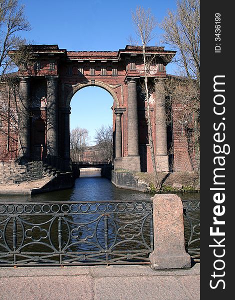 Ancient architectural arch in St.-Petersburg in Russia. Architectural sight of city. Ancient architectural arch in St.-Petersburg in Russia. Architectural sight of city.