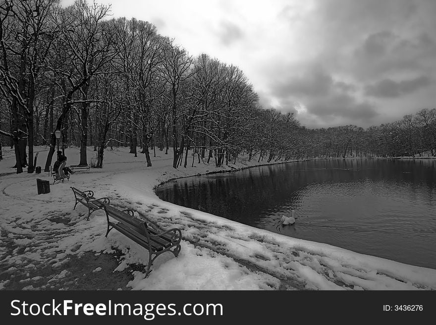 Lake in winter time with cloudy sky