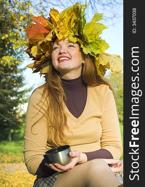 The happy girl on picnic behind city