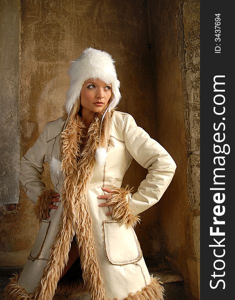 Portrait of attractive blond in fake fur trimmed coat. Portrait of attractive blond in fake fur trimmed coat.