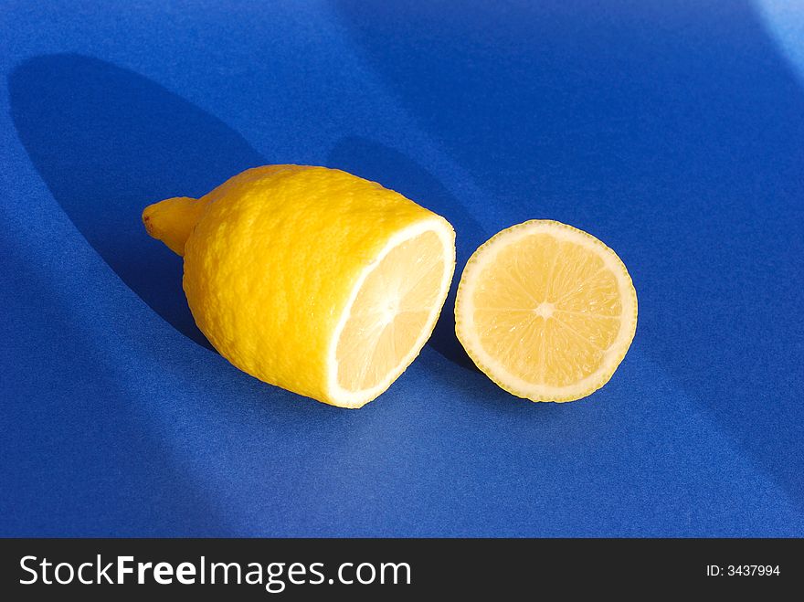 Yellow lemon on a blue background