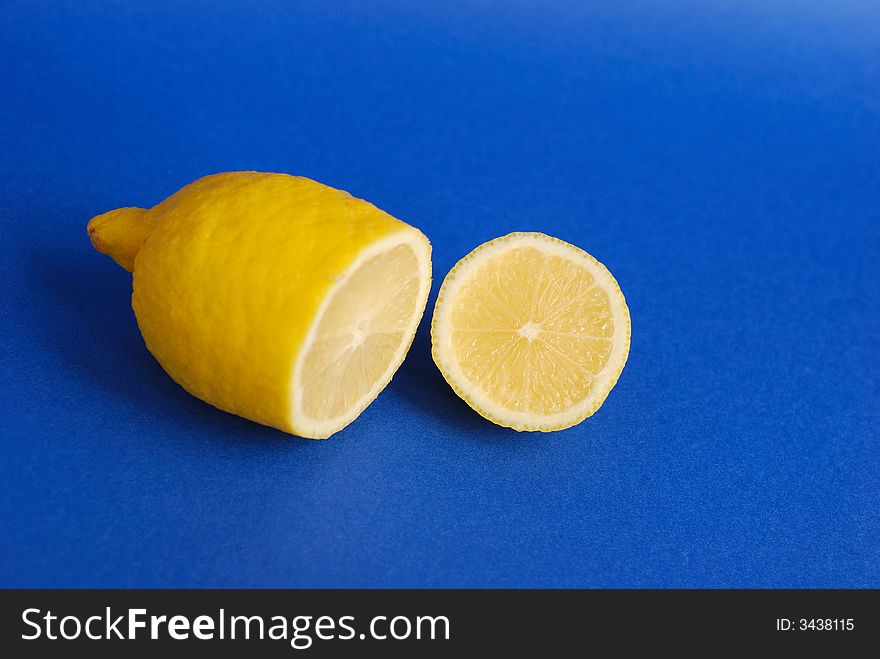 Yellow lemon on a blue background