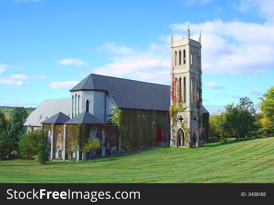 A church with tower and green grass