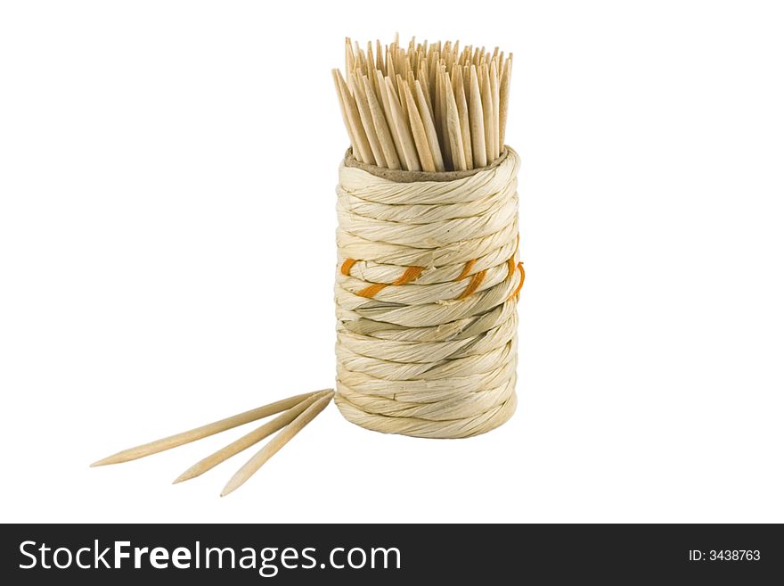 Wooden tooth-picks in the braiding box on the white background. Wooden tooth-picks in the braiding box on the white background