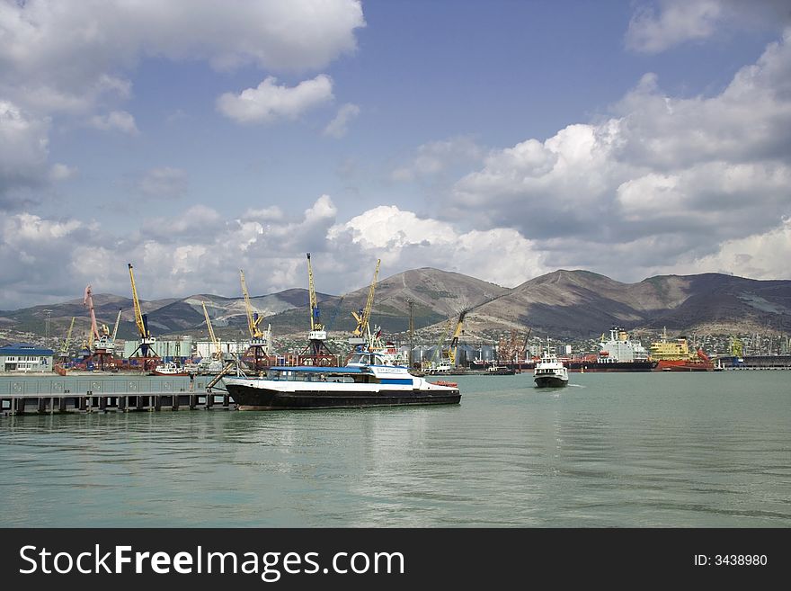 Seaport with ships and blue sky