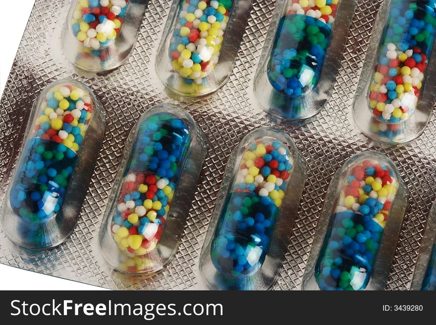 Color pills in capsules and in packing from a foil and plastic. Color pills in capsules and in packing from a foil and plastic