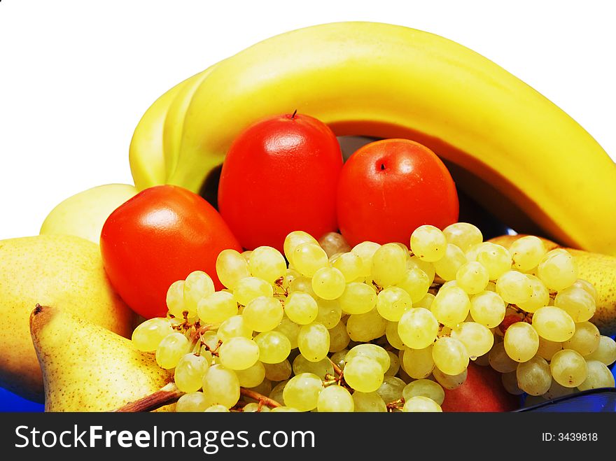 Fruits in the blue vase isolated on the white