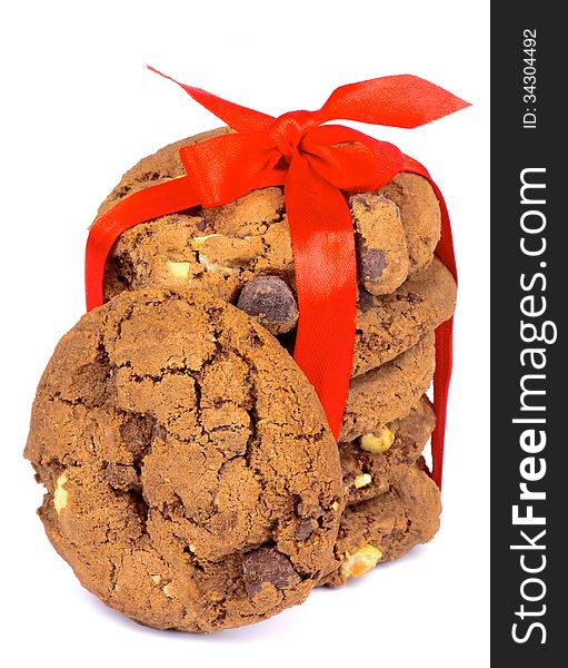 Stack of Delicious Christmas Chocolate Cookies Tied with Red Ribbon and Bow isolated on white background. Stack of Delicious Christmas Chocolate Cookies Tied with Red Ribbon and Bow isolated on white background