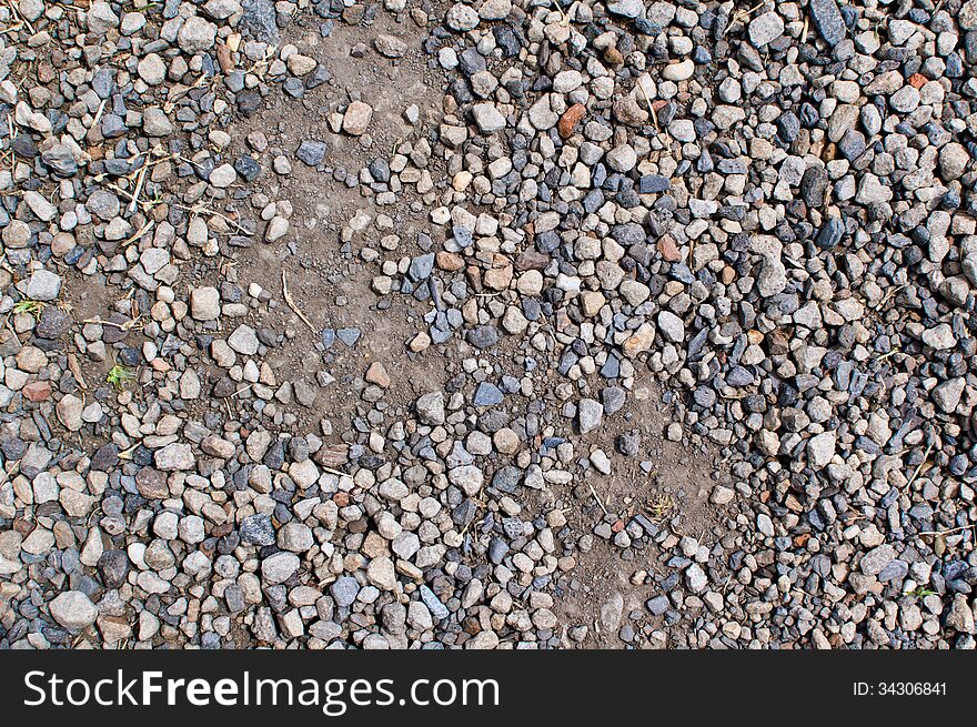 Texture of a disturbed dusty gravel path. Texture of a disturbed dusty gravel path