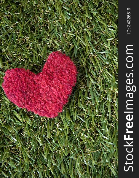 Red Heart On Grass Background