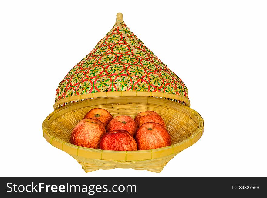 Apples in basket and lid on white background