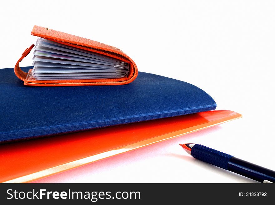 Business card holder on a folder of papers. Business card holder on a folder of papers