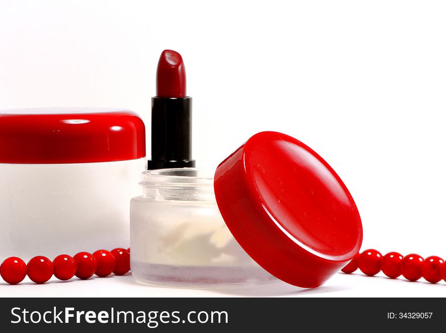 Face cream and, lipstick on a white background. Face cream and, lipstick on a white background