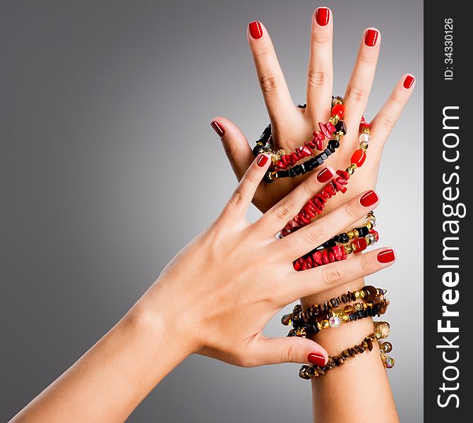 Closeup photo of a female hands with red nails