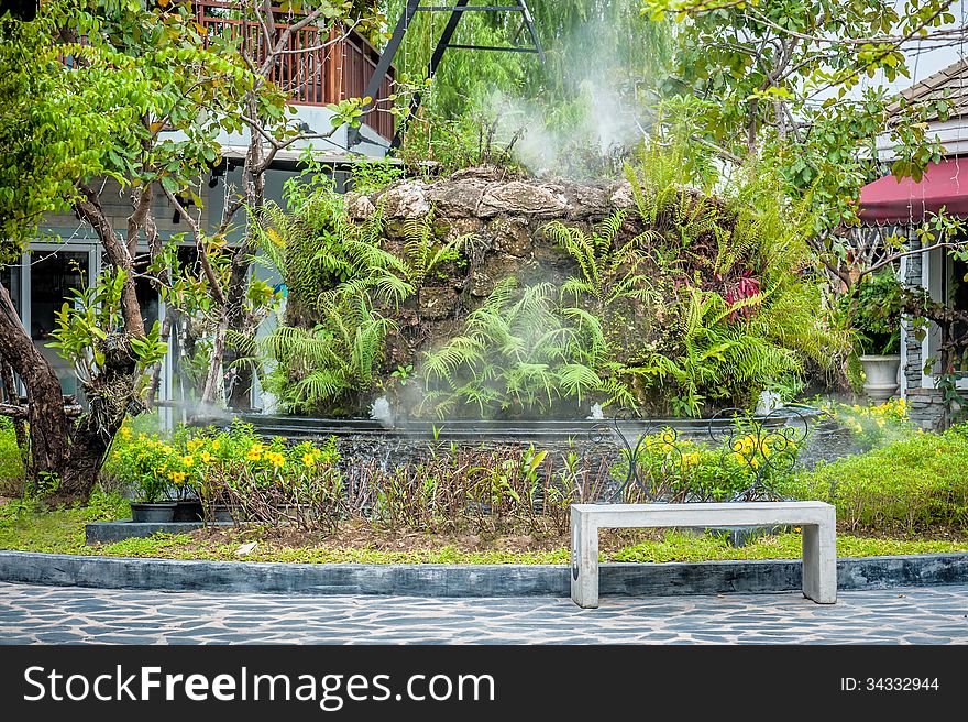 Stone chair in Garden with steam