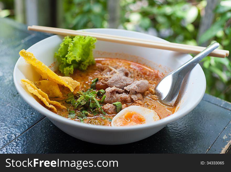 Pork noodle tom yum, condensed water egg.