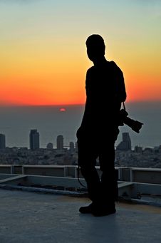 Silhouette Of A Photographer In The Sunset From A Skyscraper Royalty Free Stock Image