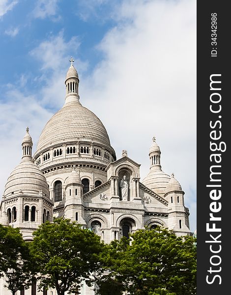 Sacre Coeur Cathedral in Paris, France, under a blue sky. Sacre Coeur Cathedral in Paris, France, under a blue sky.