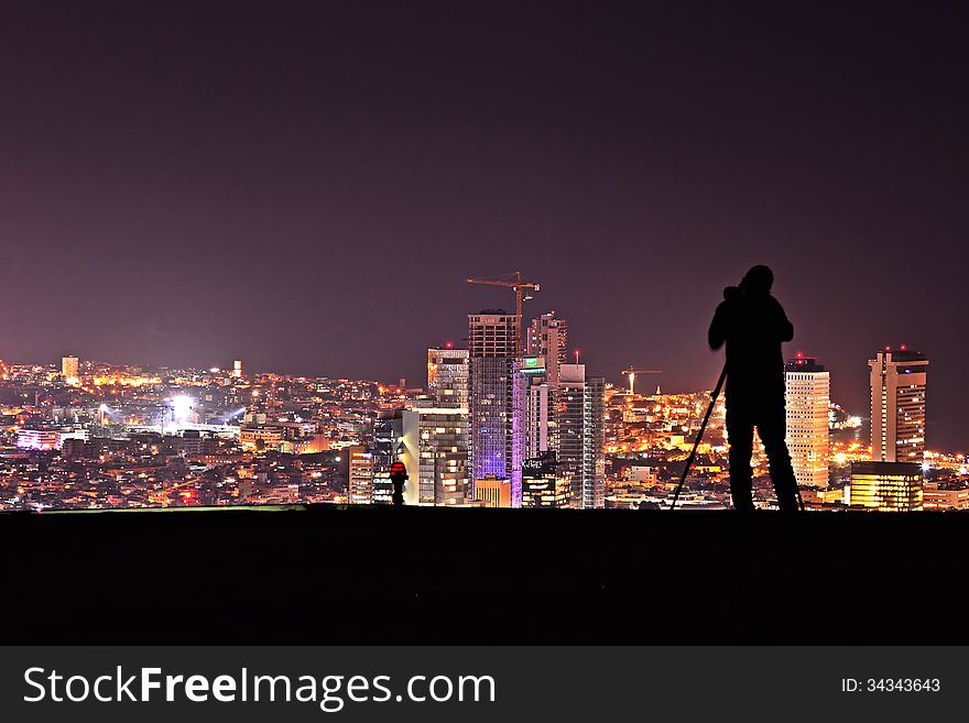 Photografer take a photograph of Tel Aviv Skyline