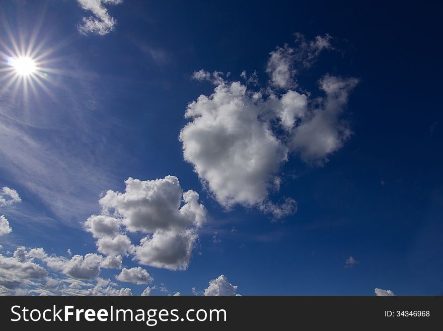 Blue sky with clouds and sun. Blue sky with clouds and sun