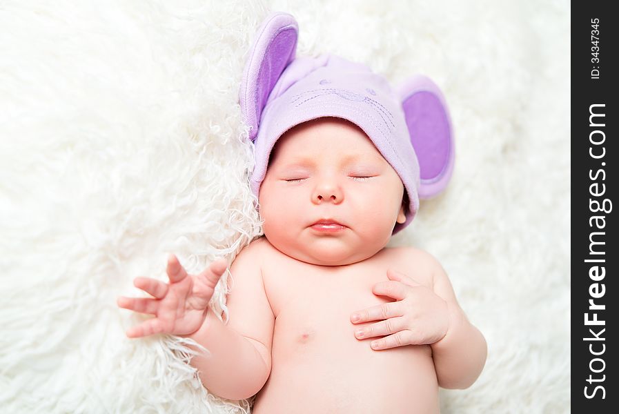 Cute Newborn Baby Sleeps In A Hat With Ears