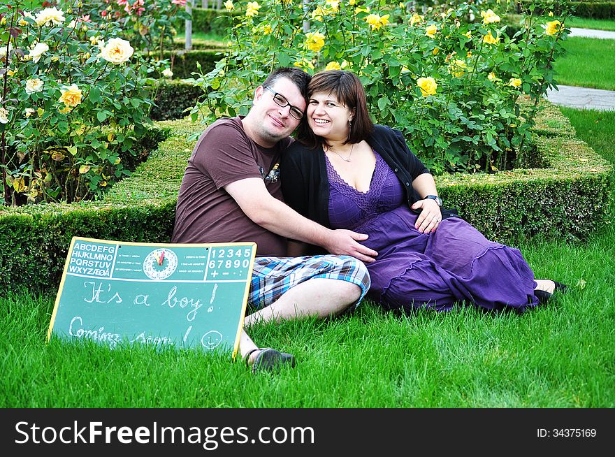 Happy pregnant women with her husband in the park. Happy pregnant women with her husband in the park.