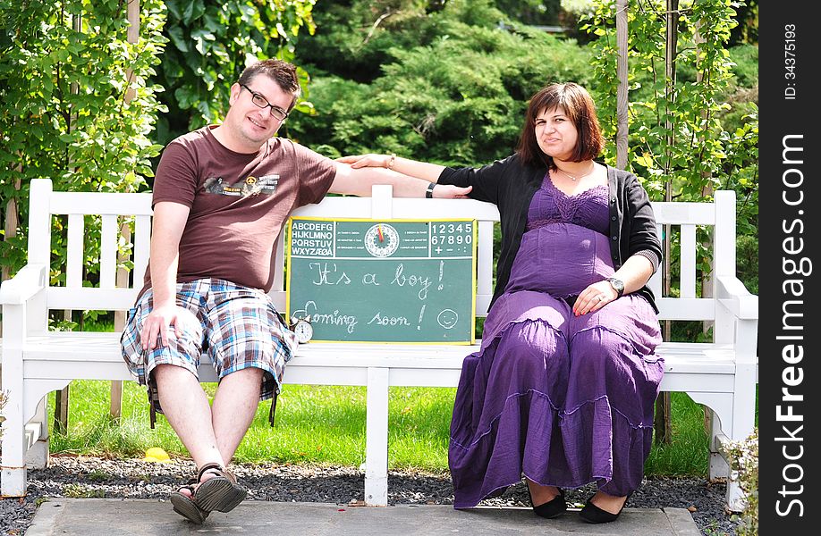 Happy pregnant women with her husband in the park. Happy pregnant women with her husband in the park.