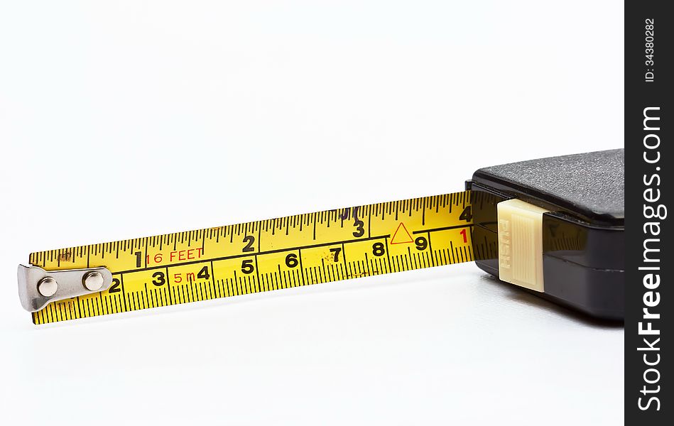 The old tape measure on white background. The old tape measure on white background.