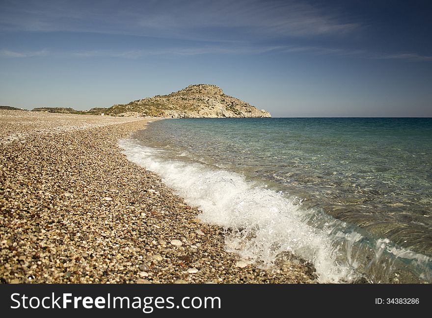 A deserted beach on the east coast of Rhodes. Warm October. A deserted beach on the east coast of Rhodes. Warm October