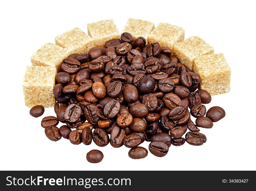 Coffee grains and refined sugar isolated on a white background, shot in studio. Coffee grains and refined sugar isolated on a white background, shot in studio