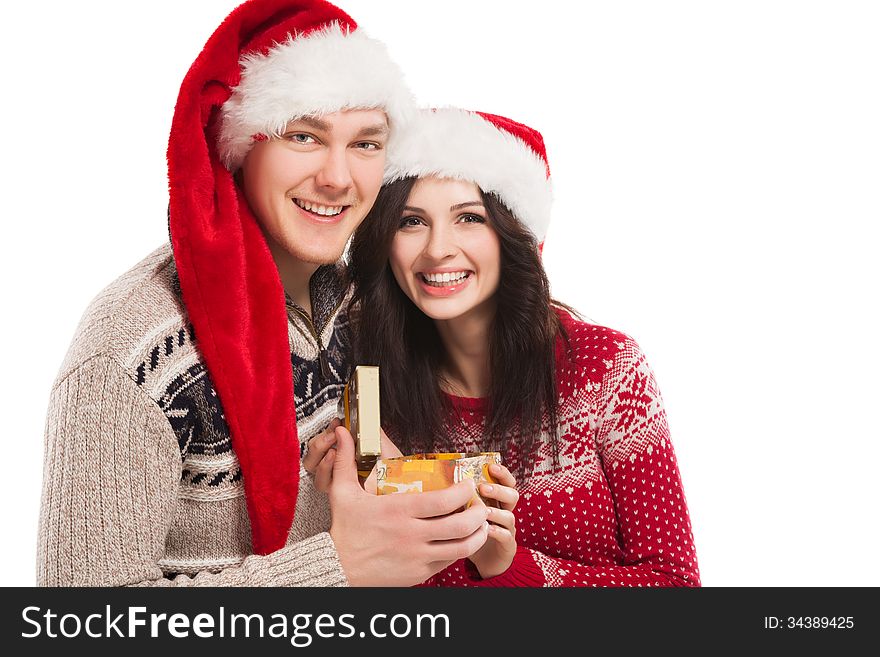 Young Happy Couple Near A Christmas Tree.