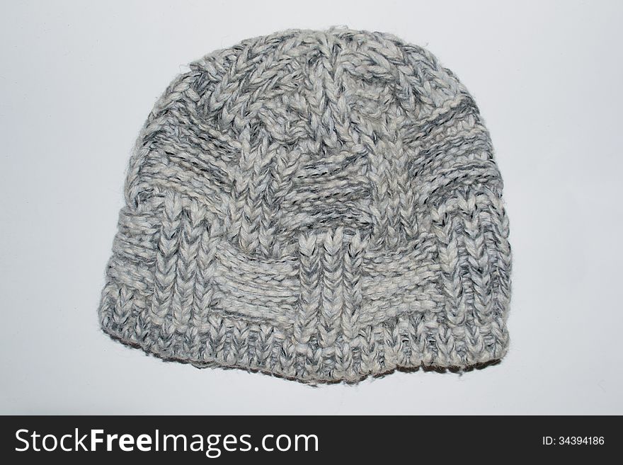 Knitted gray woolen hat isolated. Knitted gray woolen hat isolated