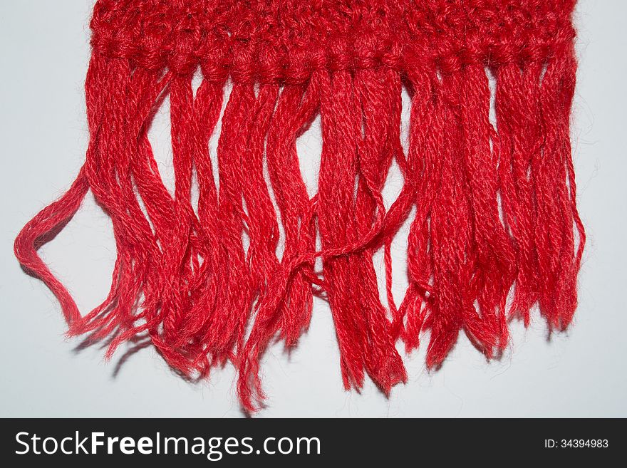 Knitted red wool scarf background. Knitted red wool scarf background