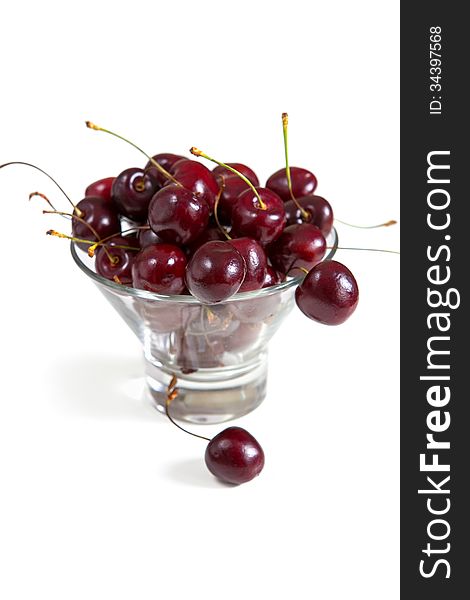 Fresh cherries in bowl, isolated on white
