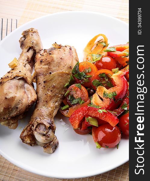 Grilled chicken legs with vegetable salad