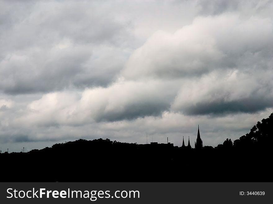 Storm cloudscape over Lviv old town as silhouette. Storm cloudscape over Lviv old town as silhouette