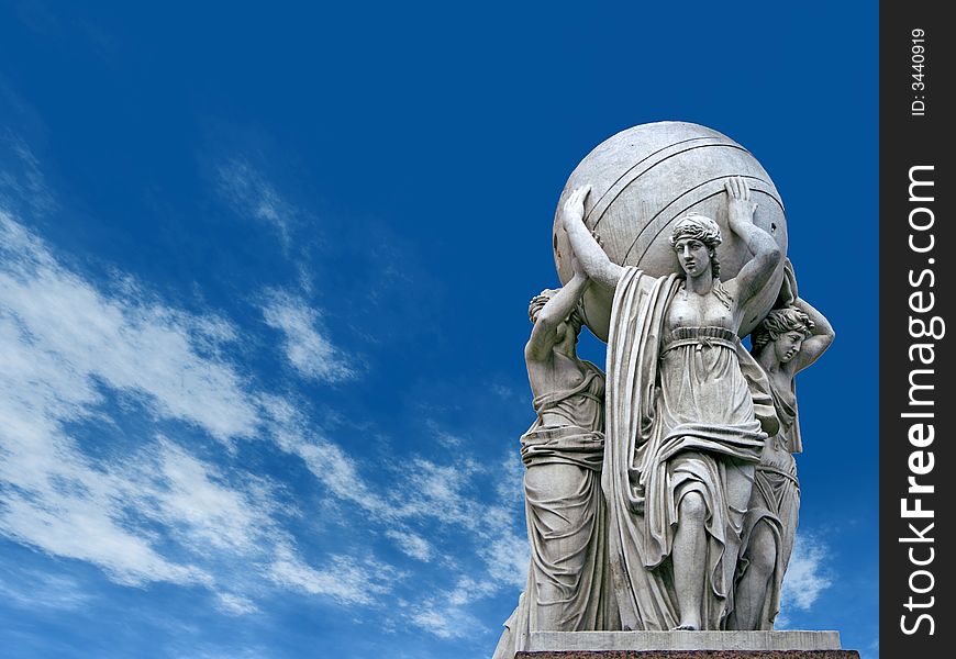 Allegorical statues about admiralty on a sky  background. St.Petersburg , Russia