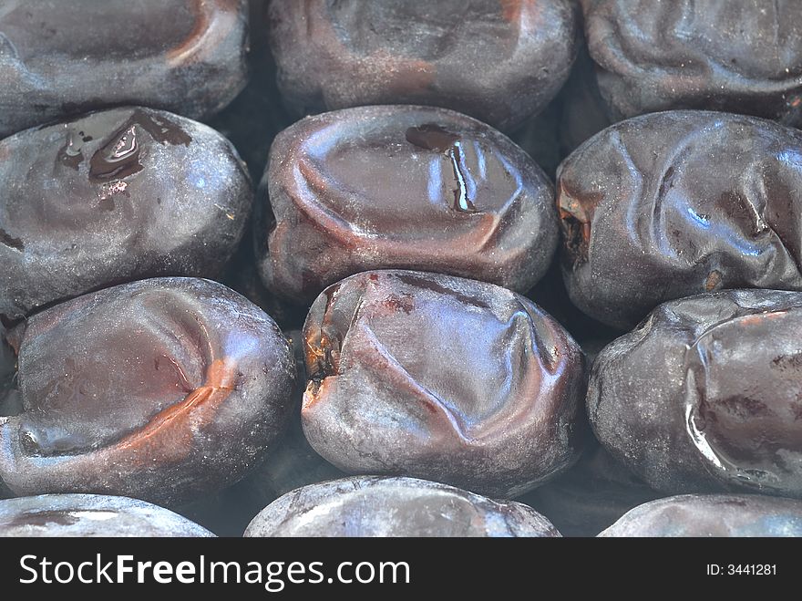 Close up of black dates from persian golf