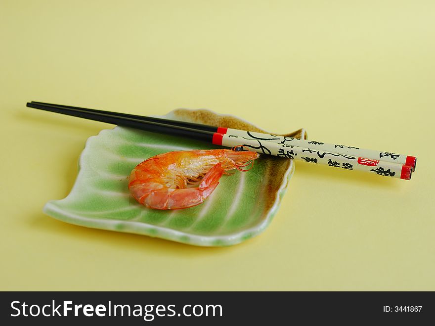 Shrimp and lemon on a plate close up