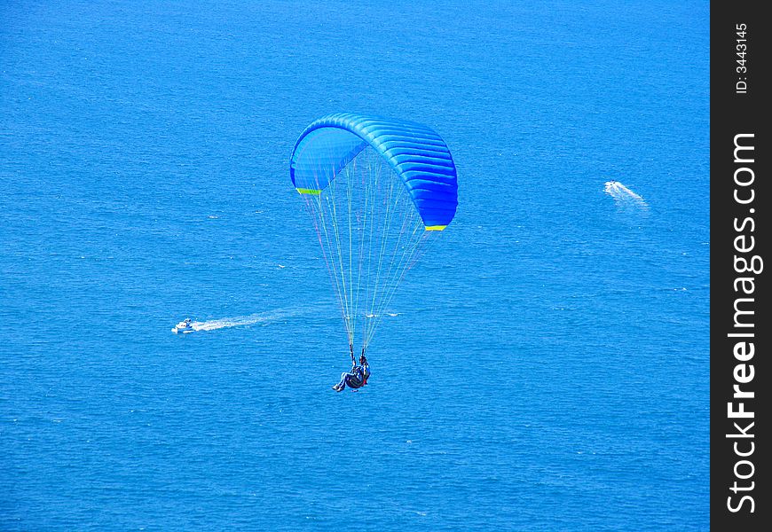 Parachute Flying In The Blue Sky
