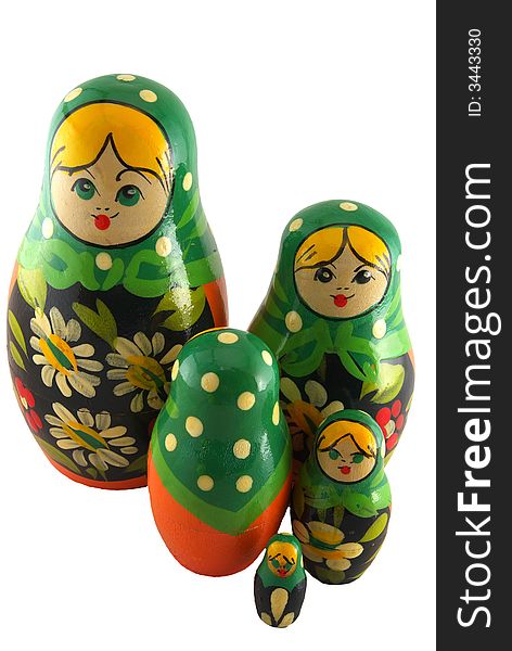 Five hand painted orange and green matryoshka dolls isolated on white. The central doll is a nonconformist, facing the opposite direction of the rest.