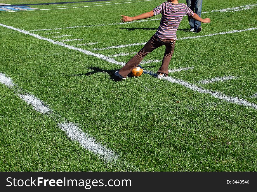 Lower body shot of a girl playing soccer. Lower body shot of a girl playing soccer