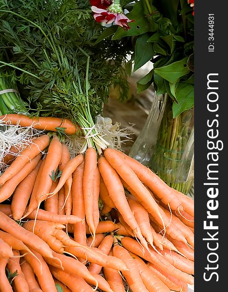 Bundles of organic, fresh carrots for sale at local farmer's market