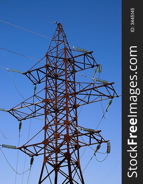 Power line; electrical pylon on clear blue sky. Power line; electrical pylon on clear blue sky