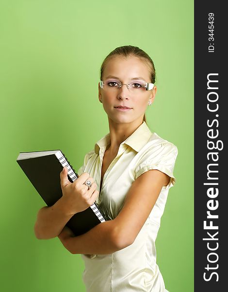 Business portrait of a young and successful woman with a folder. Business portrait of a young and successful woman with a folder